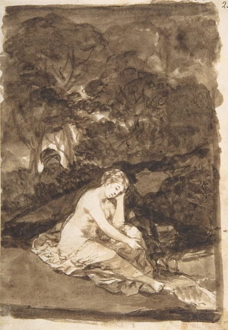 一个半裸的女人坐在小溪边