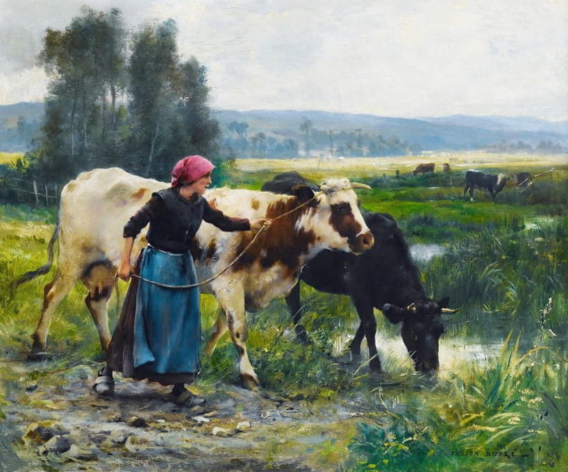 带着两头奶牛的年轻农妇