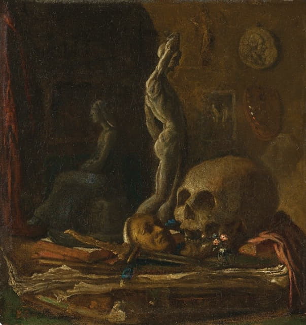艺术家工作室桌子上的骷髅、面具、剑、小雕像和书