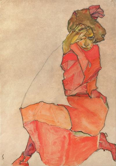 跪着的女性穿着橙红色连衣裙