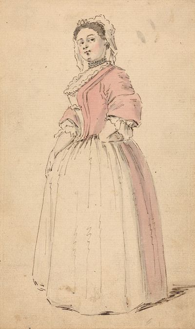 一个穿着粉色连衣裙的年轻女人